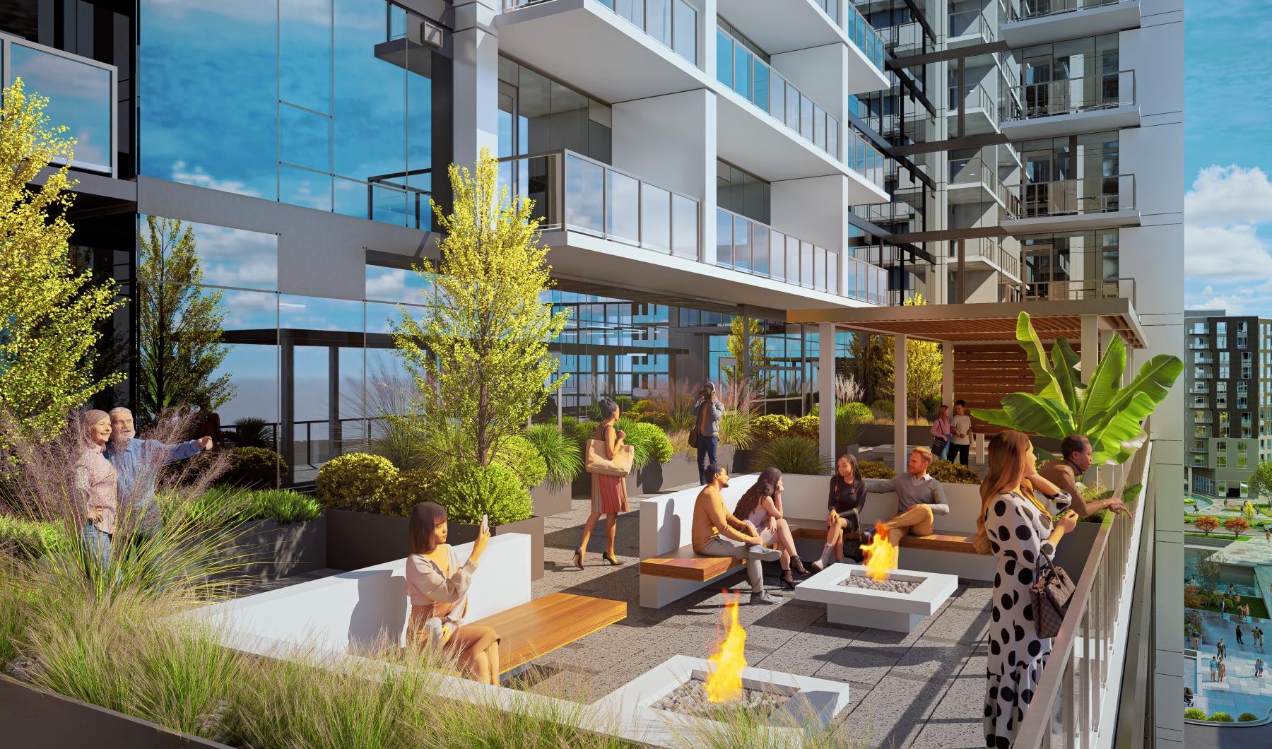 a rooftop patio with people and a fire pit